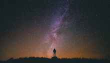 person sky silhouette night universe stars